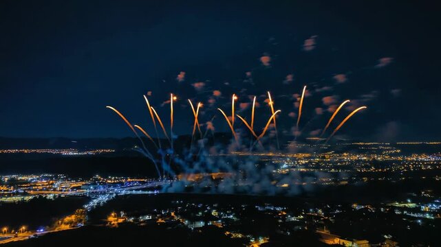 Aerial view of festive fireworks show creating magical patterns in the night sky
