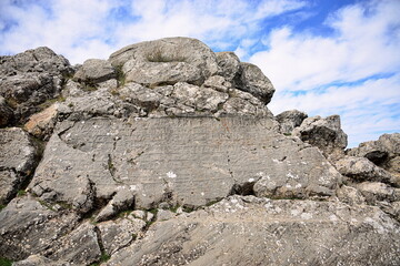 TURKIYE,HATTUSA,02-03-2024.It was the capital of the Hittite Empire. The earliest traces of settlement on the site are from the sixth millennium BC.In the photo ,Reliefs,Hieroglyphs ,writin
