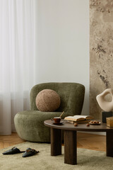 Plakat Soft toned living room with design armchair, wooden table and personal accessories. Earthy and organic mood.