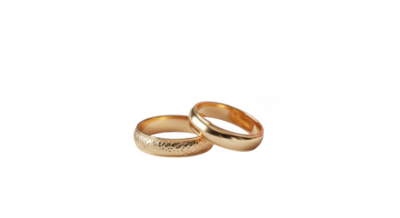 Two elegant gold wedding rings with intricate patterns resting together on a plain surface isolated on transparent background