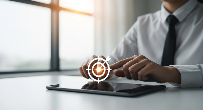 Business target, businessman touching digital goal icon on tablet screen, concept of strategic planning, objective setting and performance tracking in business
