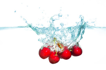 Group of Fresh Sweet Cherries Splashing in Crystal Clear Water