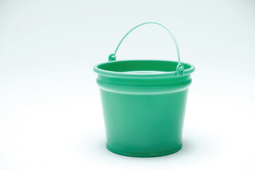 Green pail on white backdrop. Clean image, bucket isolated object.