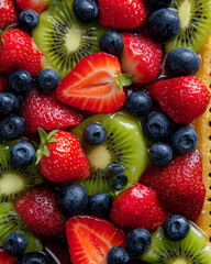 Obraz premium Colorful fruit tart with strawberries, blueberries, and kiwi, glossy glaze1