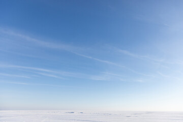 Pristine Snowy Landscape Under Vast Clear Blue Sky on a Sunny Winter Day