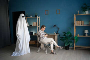 Concept of Life and death, afterlife, memory lost love. Male ghost. Woman using smartphone while...