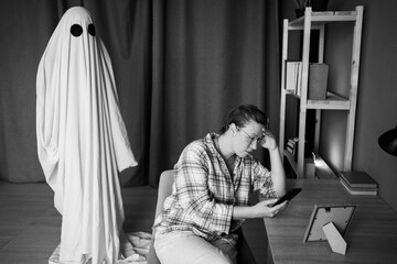 Life and death. Concept of afterlife and memory for lost love. woman sitting on chair using...