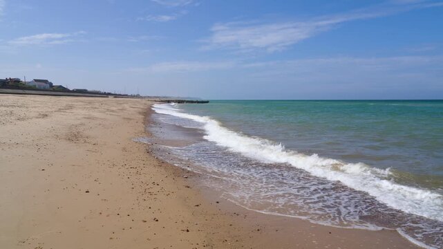 North Sea waves coming in at the beach in Walcott, UK, holiday or vacation video