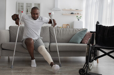 Bone fracture after incident, treatment at home, recovery. Black middle aged male with broken leg...