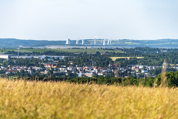 Hradek nad Nisou showcases a picturesque backdrop with the Turow Coal Mine visible in the distance. The blend of urban and industrial elements highlights the region's character.