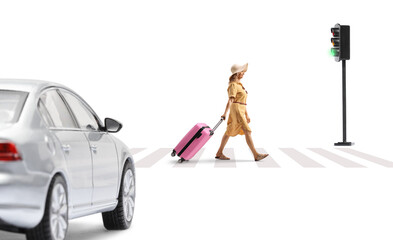 Woman walking and pulling a pink suitcase at zebra crossing