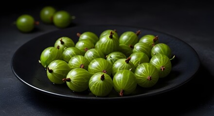 Fresh Gooseberries Arranged on Matte Black Plate: Subtle Green Highlights and Elegant Composition Showcase the Unique Texture and Vibrant Color of This Tart Fruit in Modern Food Photography