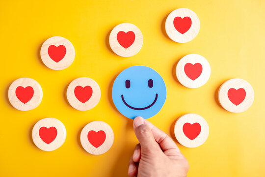 Smiley face and heart happiness, positive feedback, emotional support, satisfaction, connection, and appreciation in personal growth or customer experience concepts.
