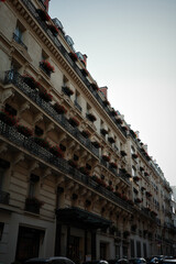 Elegant Parisian Facade with Flower-Filled Balconies