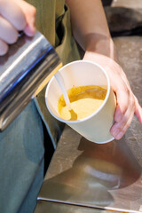 Barista crafting cappuccino with latte art