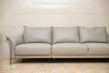 gray comfortable and stylish sofa at horizontal composition