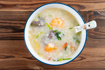 top view fresh shrimps and beef porridge at horizontal composition