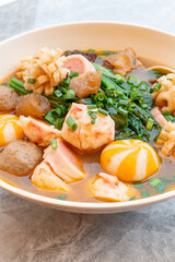 angle view bowl of ChaoZhou beef offal and various seafood ingredients at vertical composition
