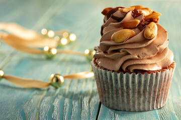 cupacke with on blue wooden table