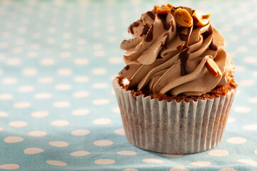 cupacke with on blue wooden tablecloth