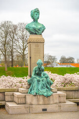 Located in Kastellet, Copenhagen, the statue of Princess Marie features a detailed bust and an...