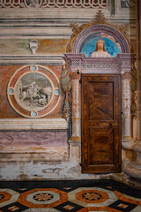 Italy, Europe: details of the frescoed walls and decorated floors of the church of the Certosa di Pavia, (Pavia Charterhouse), famous monastery complex in Lombardy built from 1396 to 1495