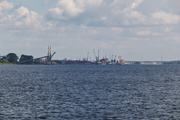 View of a large port serving container ships and bulk carriers. Sea freight transportation concept
