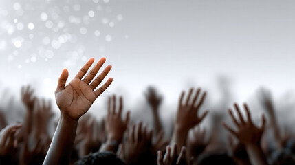Raised hand crowd unity hope diversity support participation togetherness community motivation blurred background