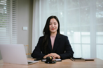 Attractive young lawyer in office Business woman and lawyers discussing contract papers with brass...