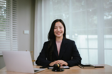 Attractive young lawyer in office Business woman and lawyers discussing contract papers with brass...