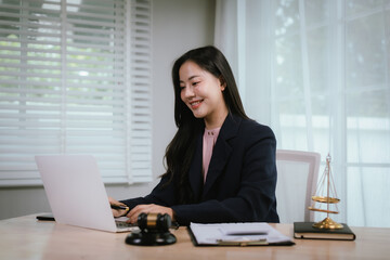Attractive young lawyer in office Business woman and lawyers discussing contract papers with brass...