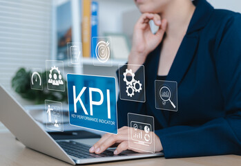 KPI Concept, Key Performance Indicators (KPIs). Professional working on laptop with KPI icons, charts, targets, data, and metrics, representing data driven performance evaluation and business strategy