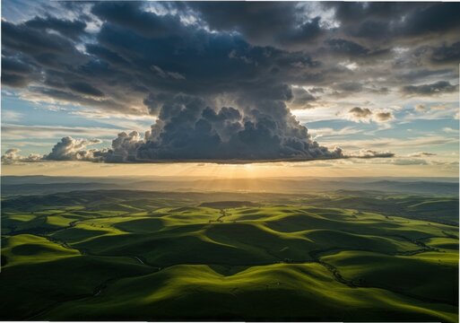 Dramatic storm clouds gather over rolling green hills at sunset
