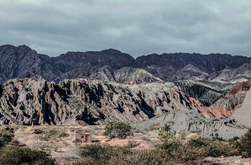 SMALL HOUSE UNDER THE MOUNTAINS OF CAFAYATE, ARGENTINA.