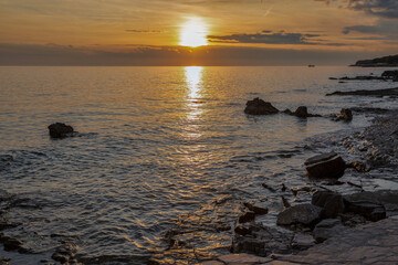 Rocky coastline at golden sunset