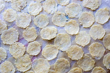 The process of making emping melinjo (melinjo chips). It tastes a little bitter and very tasty....