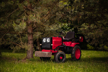 old red tractor in a field