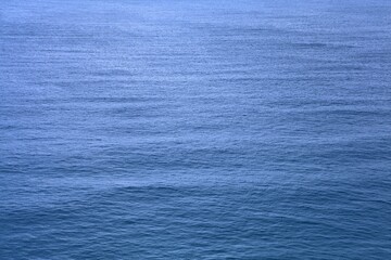 Ripples on blue sea surface background