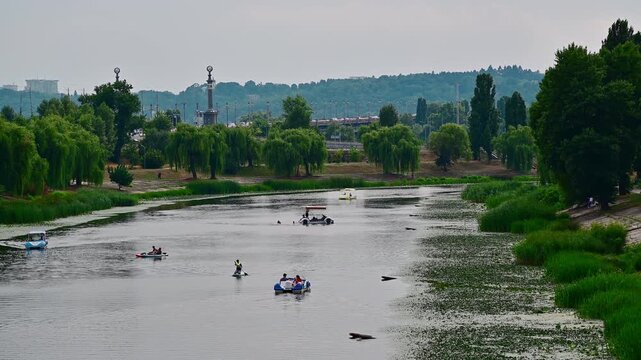 Tourists enjoying water activities on Dnipro river in Kyiv