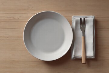 A minimalistic flat lay of a plate, fork, and napkin set on a wooden table, perfect for dining, eating, and restaurant concepts