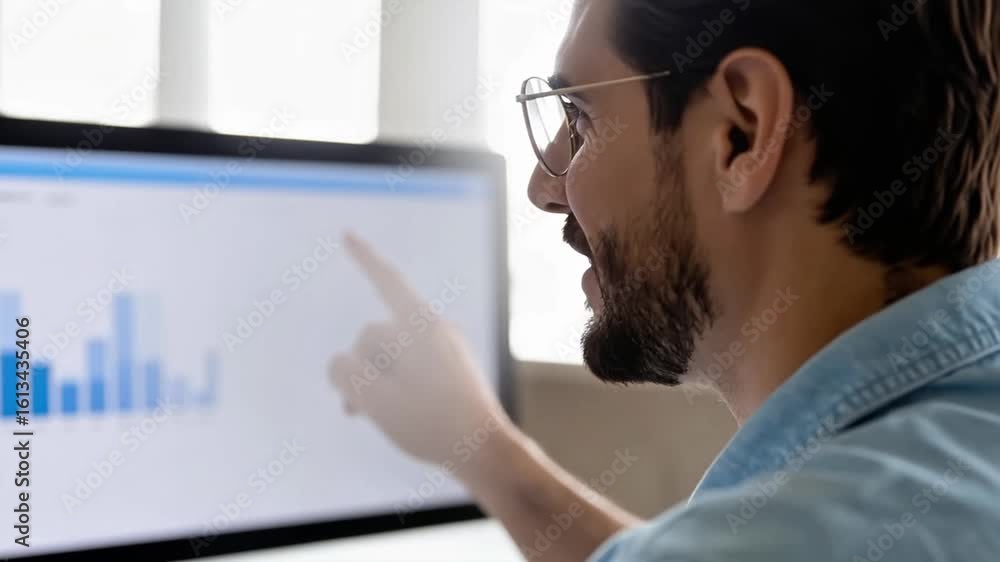 Poster professional businessman analyzing graph data on computer screen in modern office environment