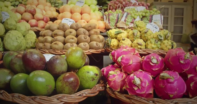 Pink dragon fruits and tropical produce on display at Madeira Lavradores Market, Portugal