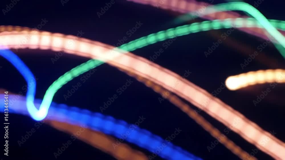 Poster abstract colorful light trails - bokeh effect on dark background