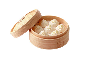 Freshly steamed Chinese xiaolongbao soup dumplings served in a traditional bamboo basket isolated on a white background.