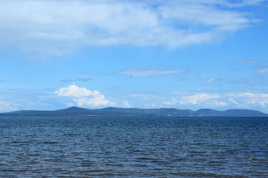 Bratsk Reservoir with Clear Sky and Distant Forested Shores