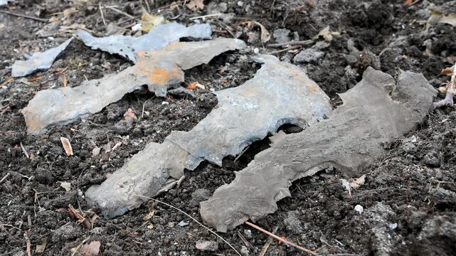 Close-up of shrapnel and missile casing debris found in a residential area on the outskirts of Kramatorsk, Ukraine. This is the evidence of a recent Russian strike on the city.
