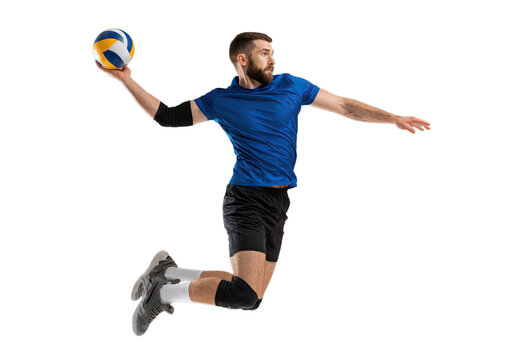Male volleyball player in mid-air, catching ball