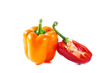 Fresh juicy shiny orange bell pepper and half of red one. Isolated on white.
