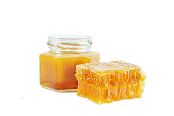 Jar with honey and honeycombs isolated on white background.