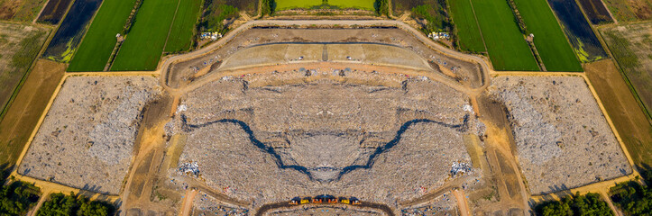 Aerial top view of A Huge Waste, garbage, dump, rubbish landfill. A landfill compactor, group of...